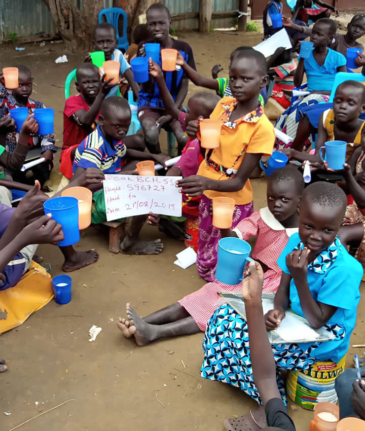 Children in South Sudan fed by a charity whose website we designed and developed