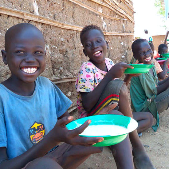 Happy African children that were fed by the charity whose website we designed